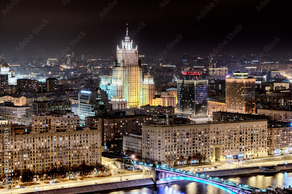 russia moscow city russia architecture cityscape downtown landmark at night against dark sky background. Aerial top side view of town skyline with russian government foreign ministry building tower