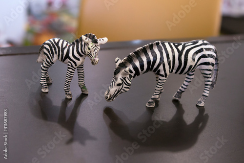 Zebra mother and her foal. Toy figure of a miniature plastic 