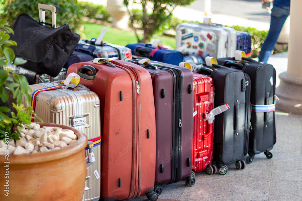 Lots of suitcases at the hotel lobby entrance. Stock-Foto | Adobe Stock