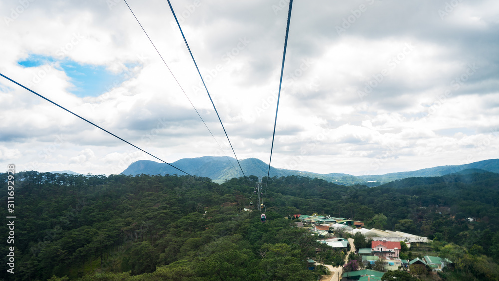 View from the Cable Car at Robin Hill, Truc Lam (Dalat, Vietnam)Aerial view for mountains, forest and lake.Amazing nature background.