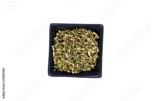 Handful of green dehydrated dried oregano herb © ecummings00