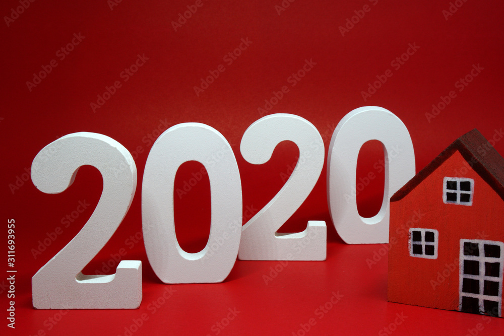 2020 number wooden figures with House figures object on red background - Happy new year 2020 , Chinese new year - red concept - home building trends
