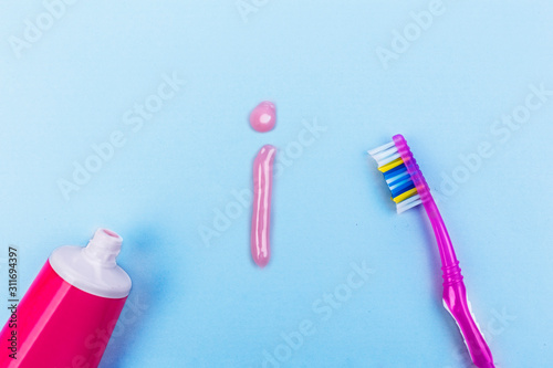 question from toothpaste, teeth care concept, toothbrush on blue background