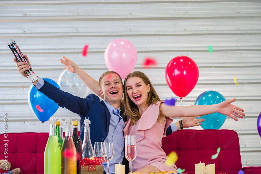 Fototapeta premium A happy young man and woman in Happy new year.