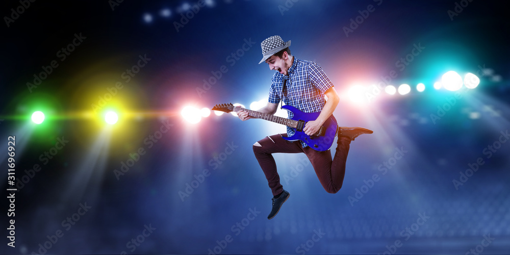 Guitarist at concert. Mixed media Guitarist at concert. Mixed media