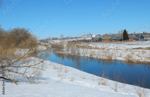 The river is flowing water. Snow-covered shores. There was a village nearby. © I_n_g_r_i_t