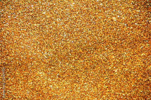 texture of golden shiny fabric with small sparkles