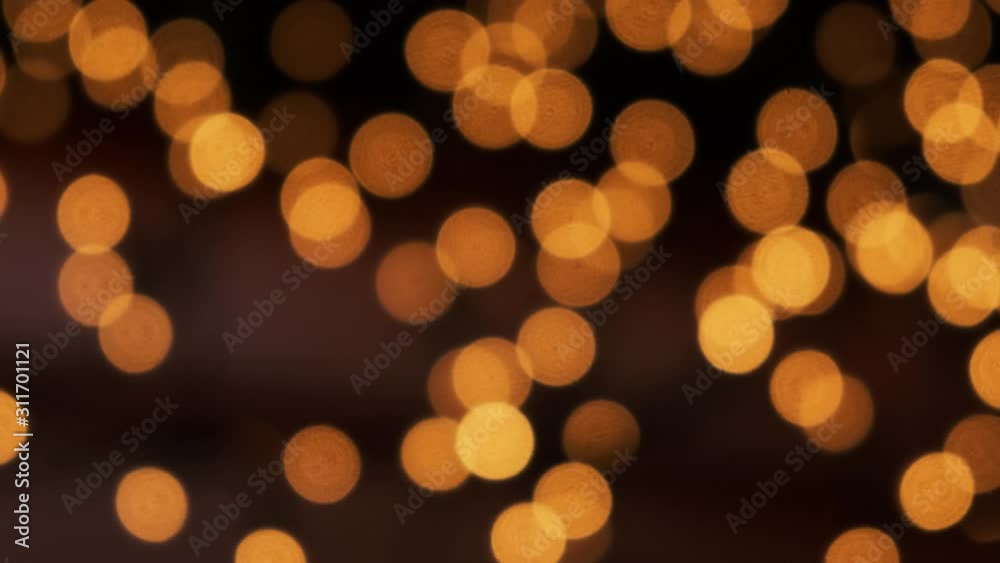 Blurred orange Christmas bokeh illumination waving. Abstract particles background 4k Blurred orange Christmas bokeh illumination waving. Abstract particles background 4k