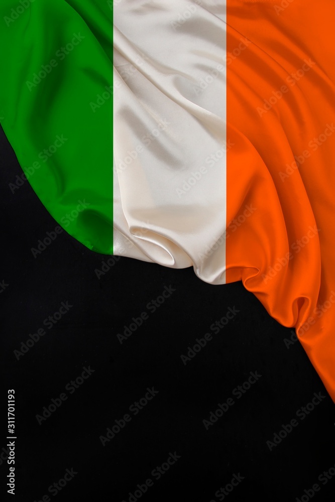 vertical color national flag of modern state of Ireland, beautiful silk, black blank form, concept of tourism, economy, politics, emigration, independence day, copy space, template
