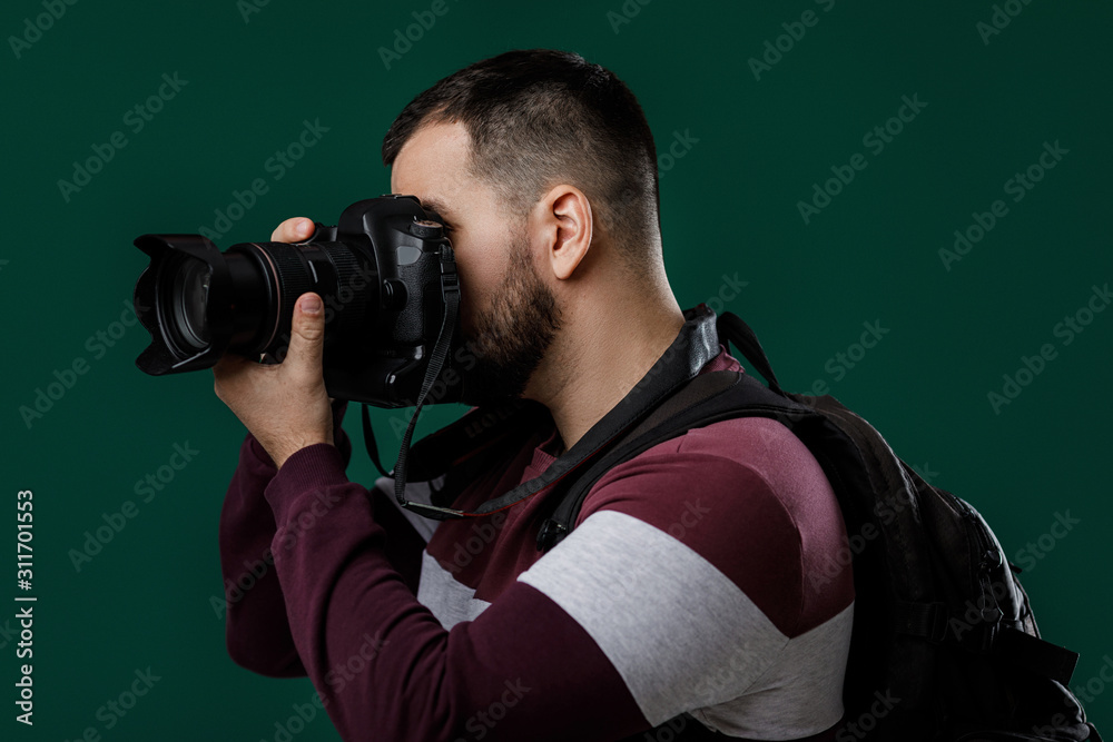 bearded man photographer takes images with professional digital photo camera bearded man photographer takes images with professional digital photo camera