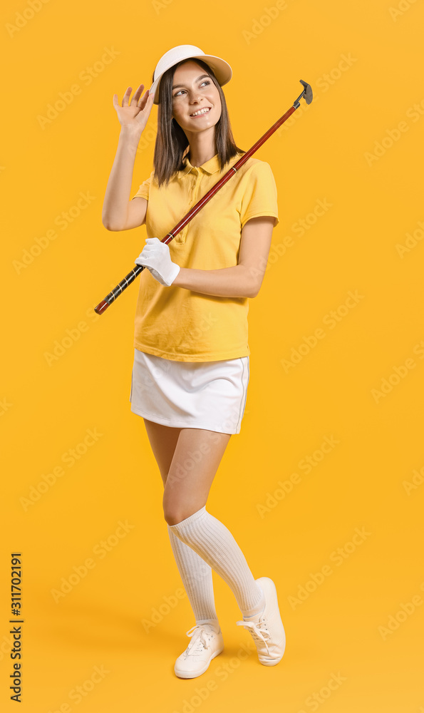 Beautiful female golfer on color background Beautiful female golfer on color background
