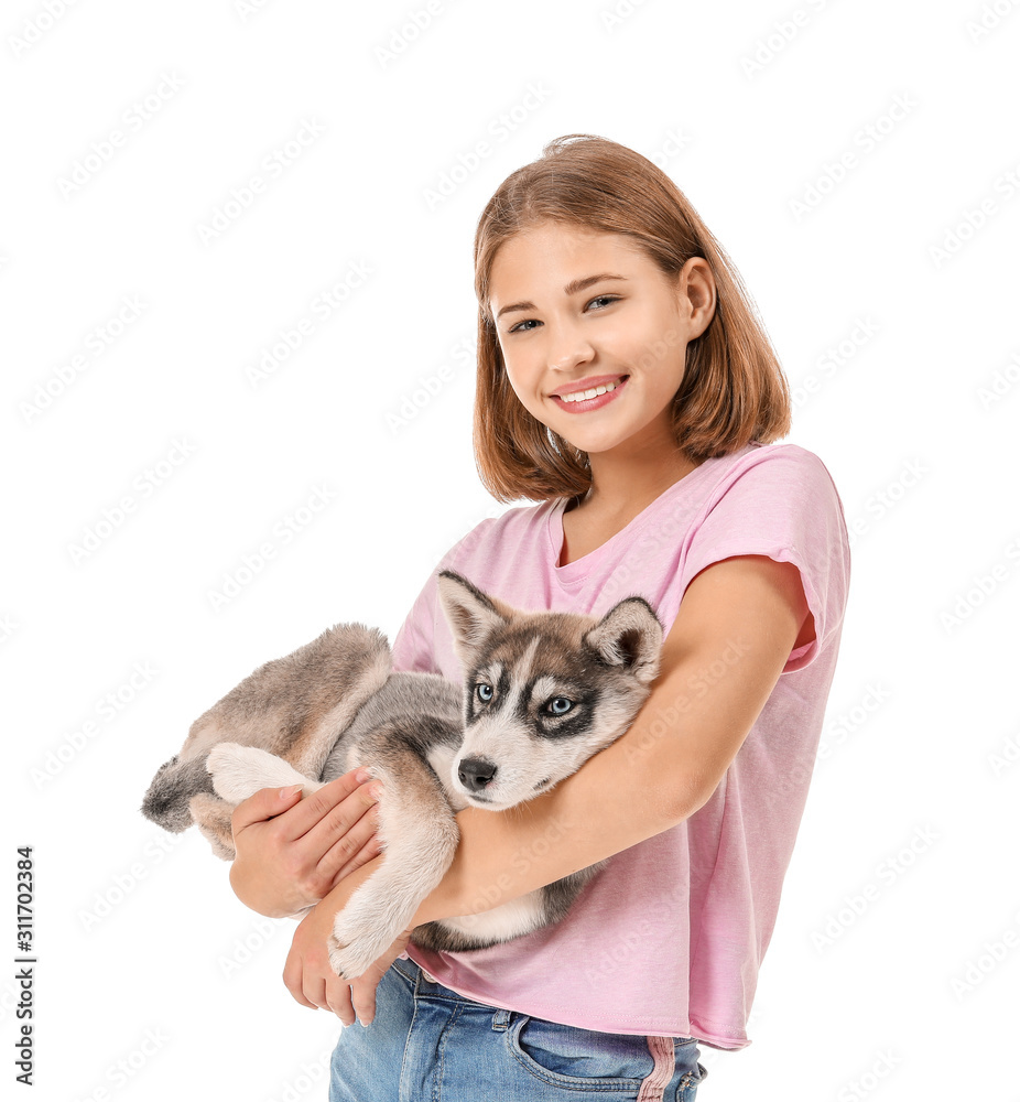 Cute teenage girl with funny husky puppy on white background Cute teenage girl with funny husky puppy on white background