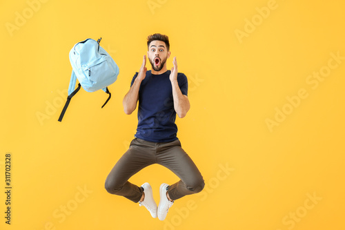 Jumping shocked young man w...