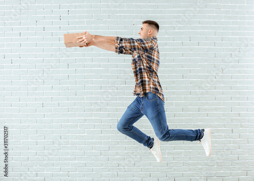Energetic young man leaping...