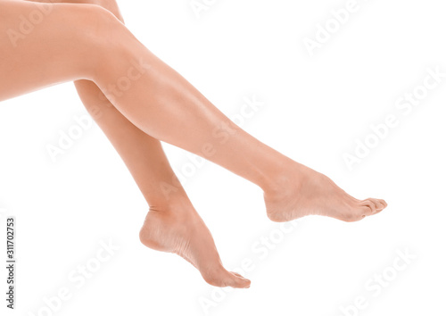 Legs of beautiful young woman on white background © Pixel-Shot
