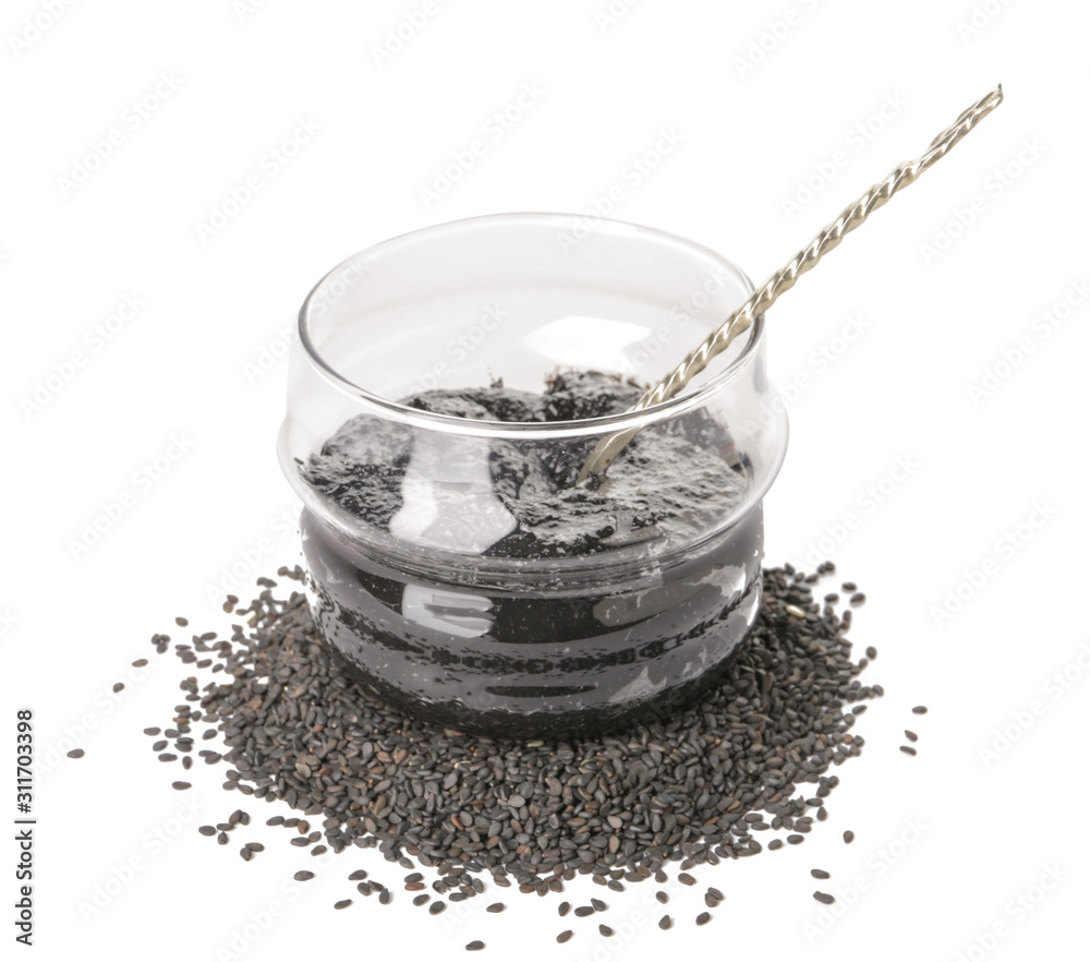 Jar of tasty tahini on white background