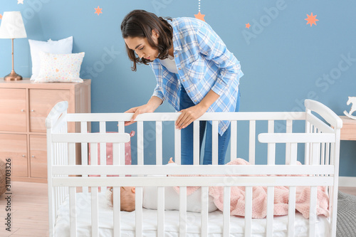 Young woman near her sleepi...