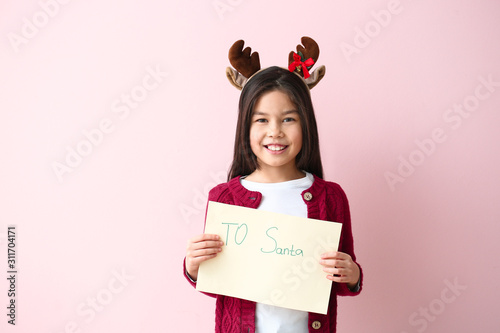 Cute little girl with lette...