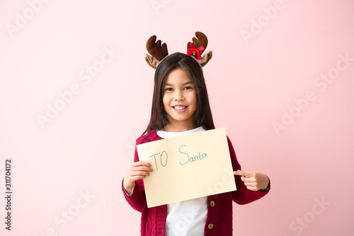 Cute little girl with lette...