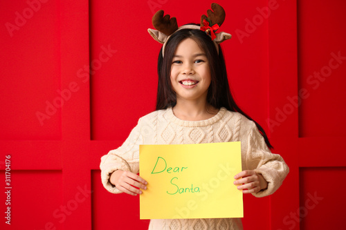 Cute little girl with lette...