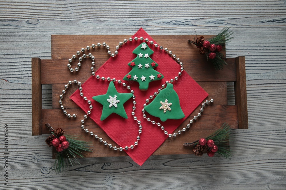 Plate with tasty Christmas cookies on wooden table Plate with tasty Christmas cookies on wooden table