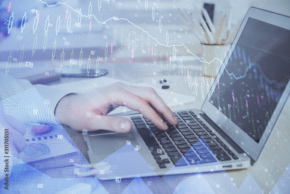 Double exposure of stock market graph with man working on laptop on background. Concept of financial analysis. Double exposure of stock market graph with man working on laptop on background. Concept of financial analysis.