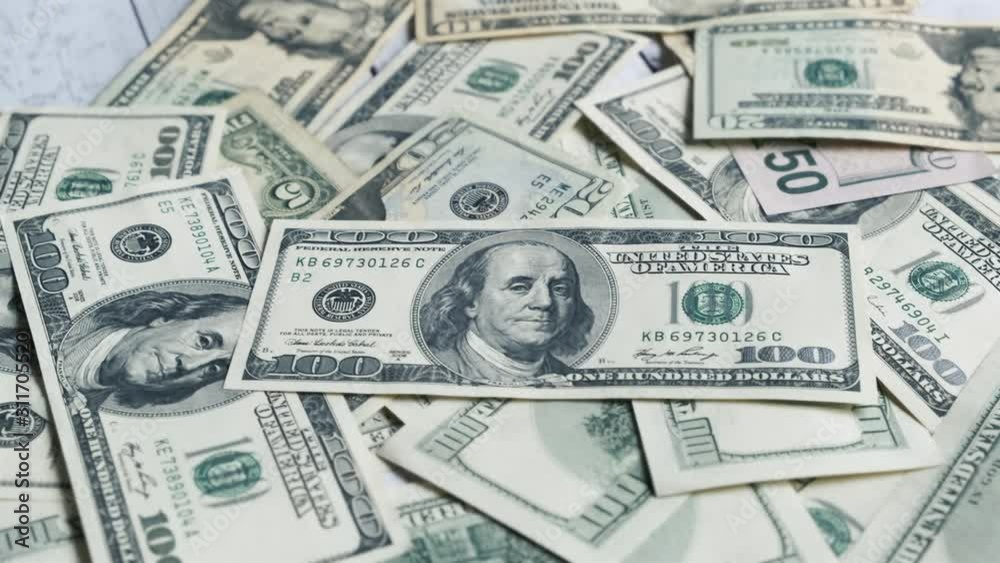 Hundred dollar banknotes on a table. Dollar bills money close-up. Background with money american dollars 4k Hundred dollar banknotes on a table. Dollar bills money close-up. Background with money american dollars 4k