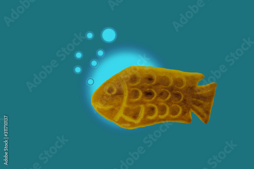 Korean snack idea. Korean fish-shaped bread in dark brue background. photo