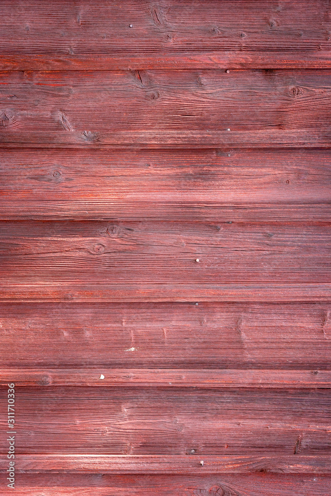 The old red wood texture with natural patterns The old red wood texture with natural patterns