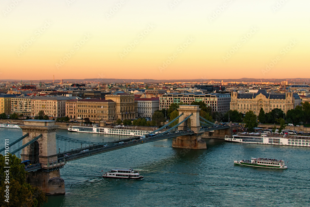 Scenic evening view of Budapest. One of the main attractions is ancient Chain Bridge over Danube River. Concept of landscape and nature. Budapest, Hungary