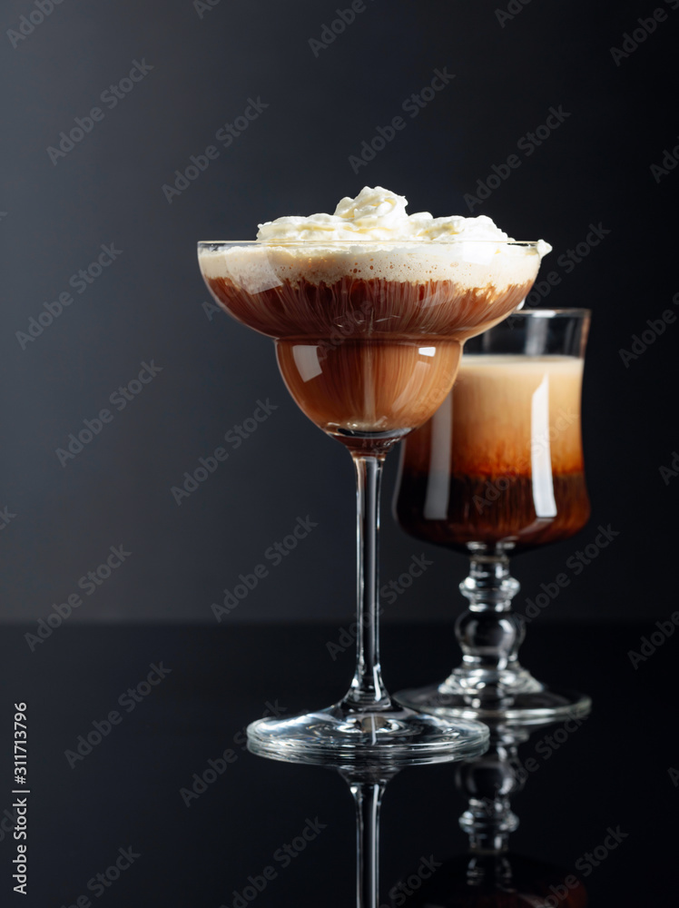 Coffee cocktails on black reflective background. Stock Photo Adobe Stock