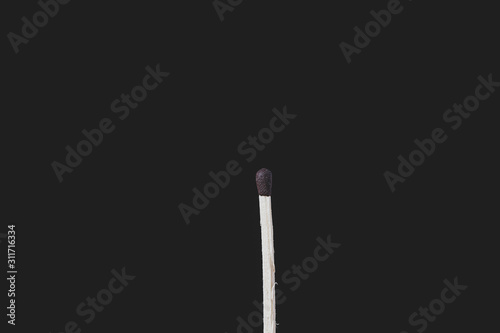 Match sticks over black background. Matte look and selective focus