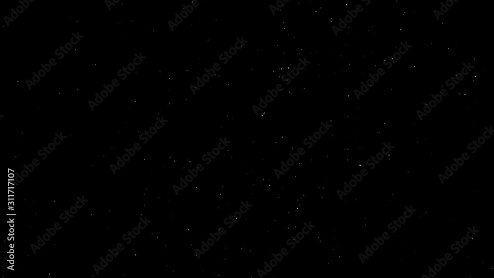 White stars moving across a black night sky White stars moving across a black night sky