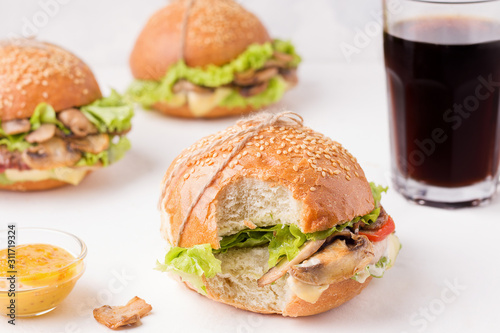 vegetarian mushroom sandwich close-up on a white background. bitten sandwich