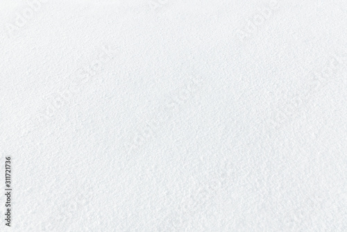 Winter background of fresh white snow with a small texture.