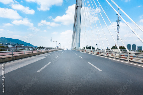 Fototapeta Naklejka Na Ścianę i Meble -  Highway overpass motion blur effect with modern city background