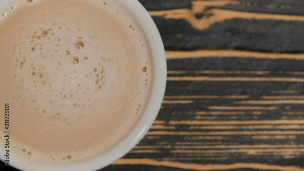 Cappuccino in a white cup on the table. Cappuccino in a white cup on the table.