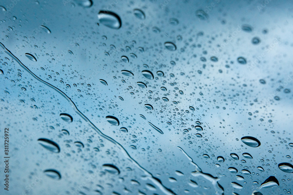Water drop on a glass during raining season Water drop on a glass during raining season