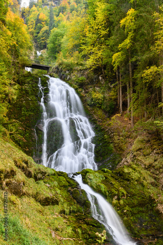 Giessbach waterfalls in autumn, interlaken, Switzerland. © pongpinun