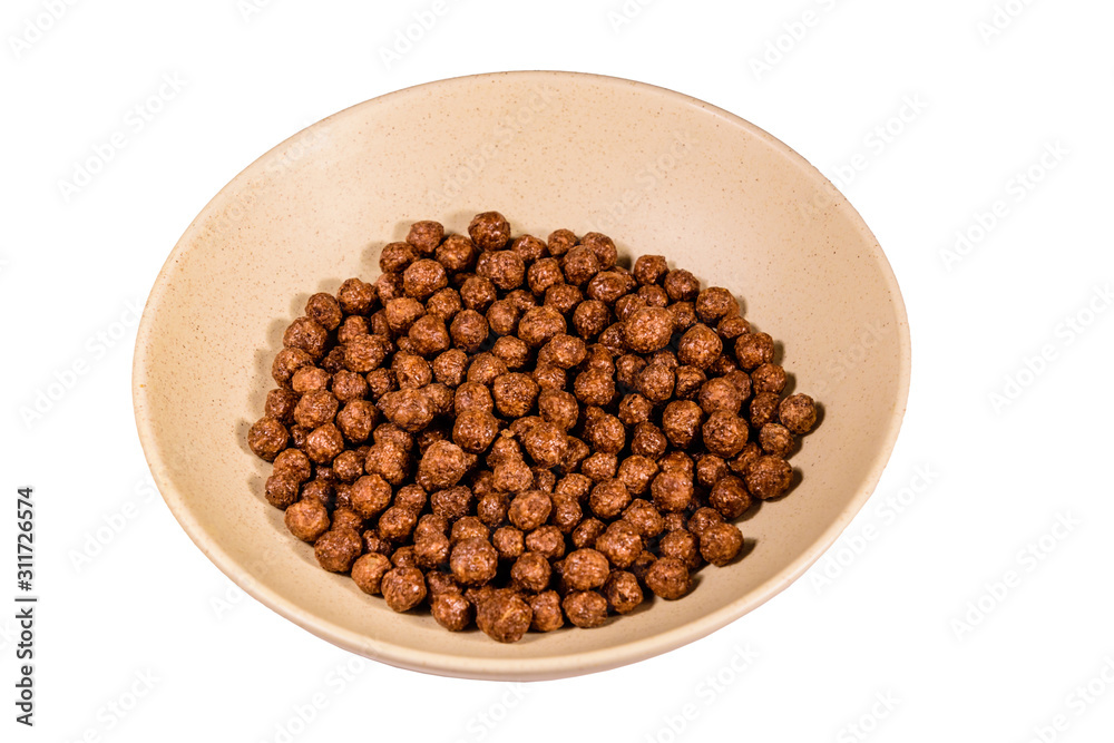 Ceramic plate with chocolate cereal balls isolated on a white background Ceramic plate with chocolate cereal balls isolated on a white background