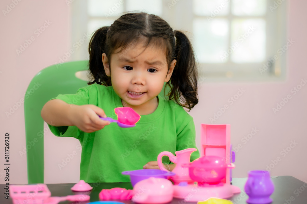 Kindergarten children in Asia are playing toys on the table. Kindergarten children in Asia are playing toys on the table.
