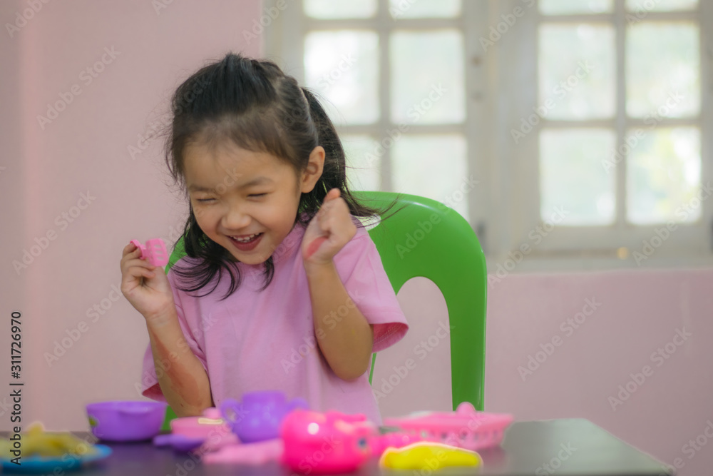 Kindergarten children in Asia are playing toys on the table. Kindergarten children in Asia are playing toys on the table.