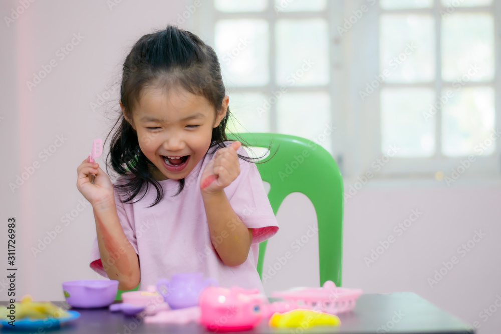 Kindergarten children in Asia are playing toys on the table. Kindergarten children in Asia are playing toys on the table.