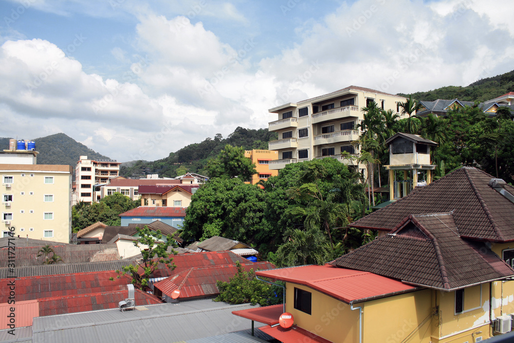 Obraz premium Phuket, Thailand-November 20, 2019: top view of hotels, houses and a street in Patong.