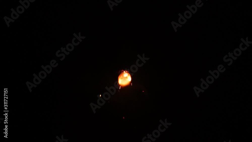  Firework with storbe light effect filmed top down on the ground by night. Firework for kids. Slow motion photo