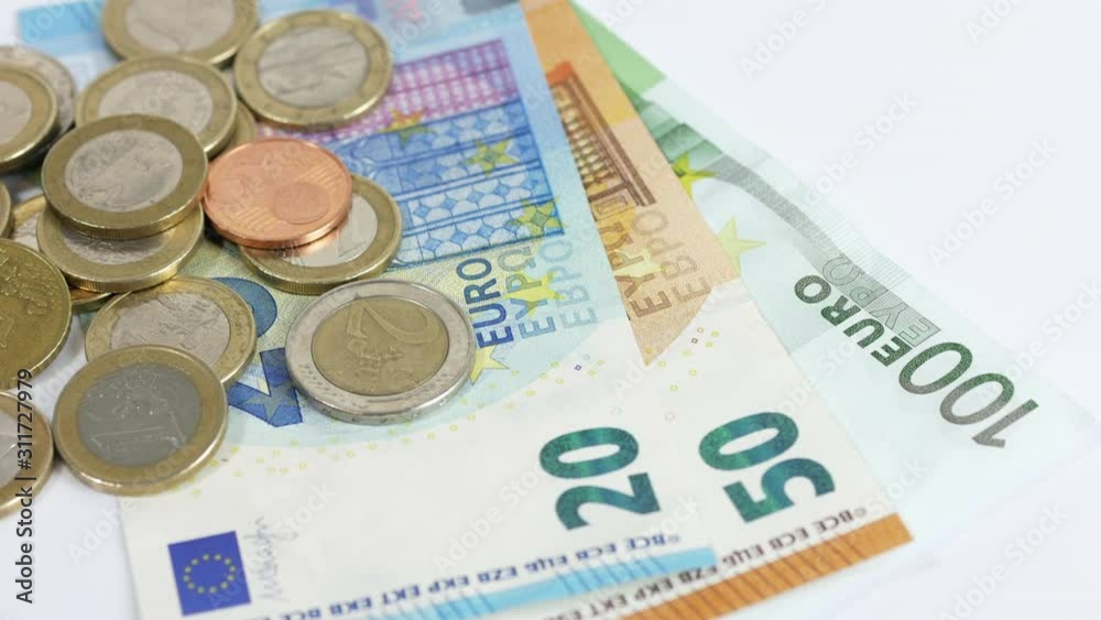 Euro coins and banknotes on white background Euro coins and banknotes on white background