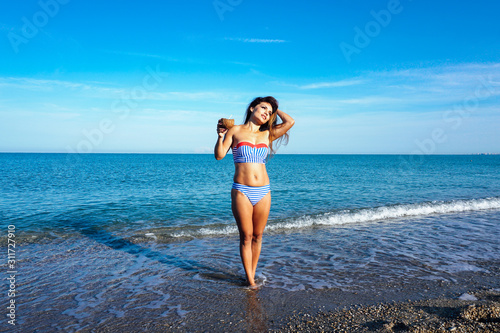 a beautiful woman in a bathing suit in the winter in the South