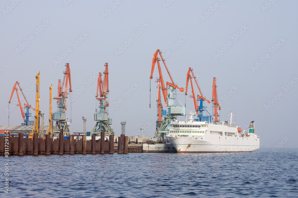 Panorama of the sea port.  At the pier there is a ship for loading and unloading cargo and for receiving passengers.