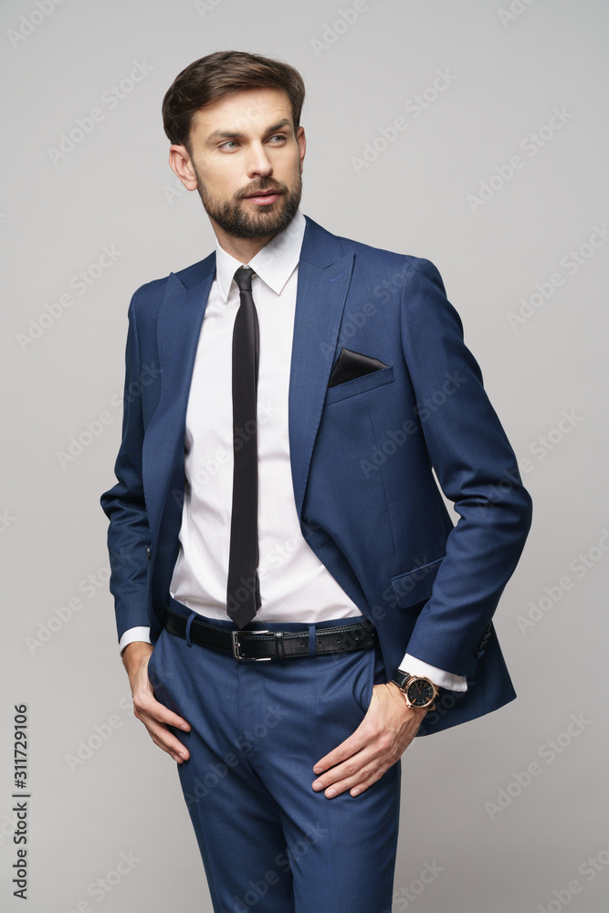 Fototapeta premium studio photo of young handsome businessman wearing suit