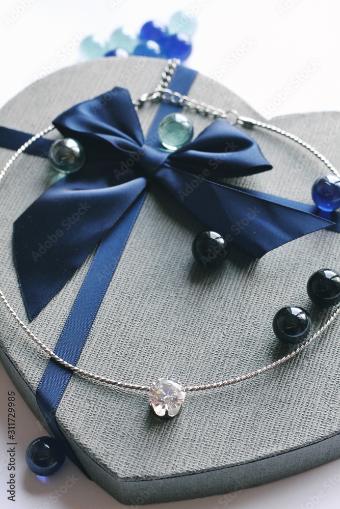Jewelry composition on interior background with bokeh